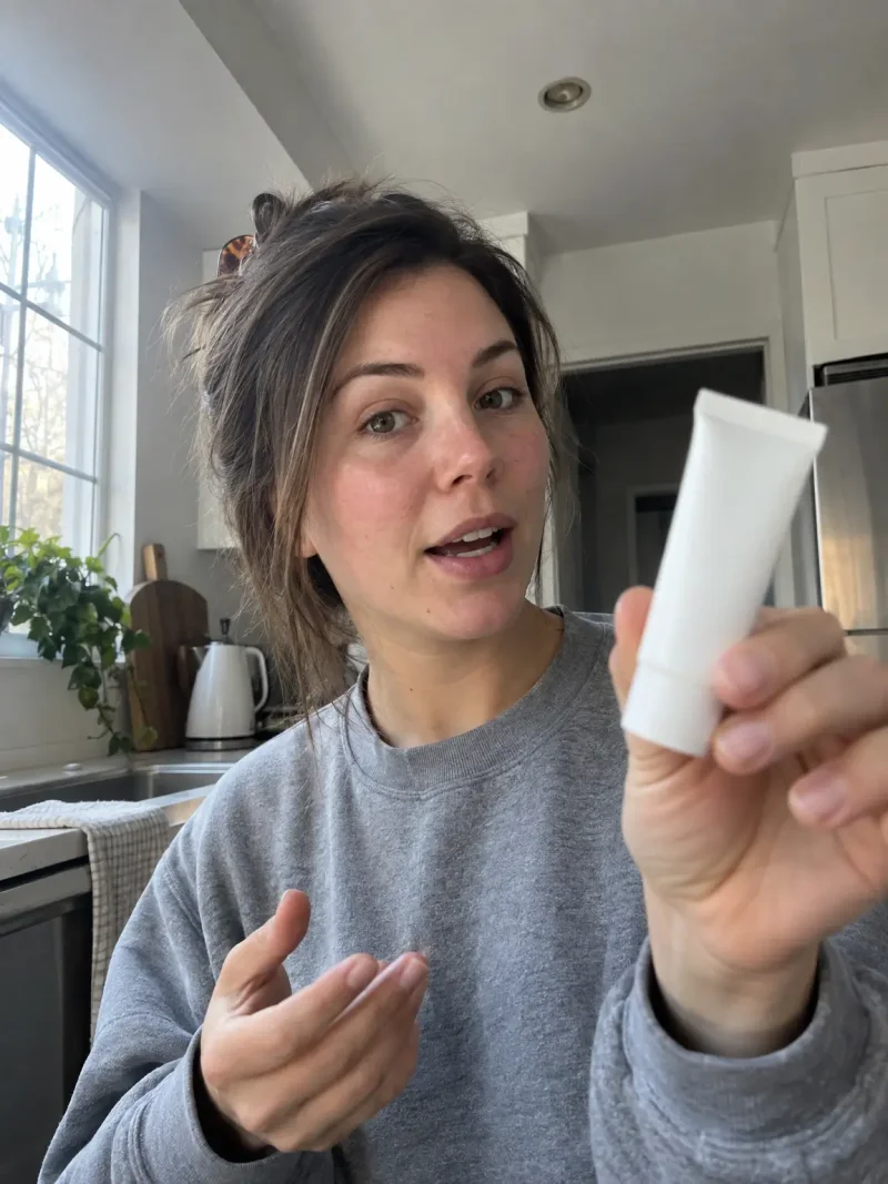 AI-generated UGC style photo of a woman demonstrating a product in her kitchen