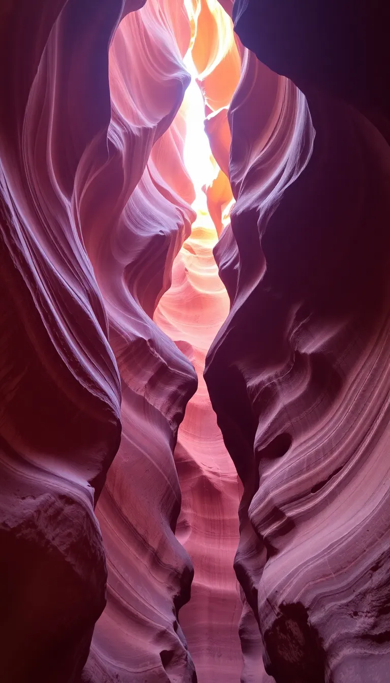 A swirling, otherworldly rock formation in Antelope Canyon with warm, reddish hues.