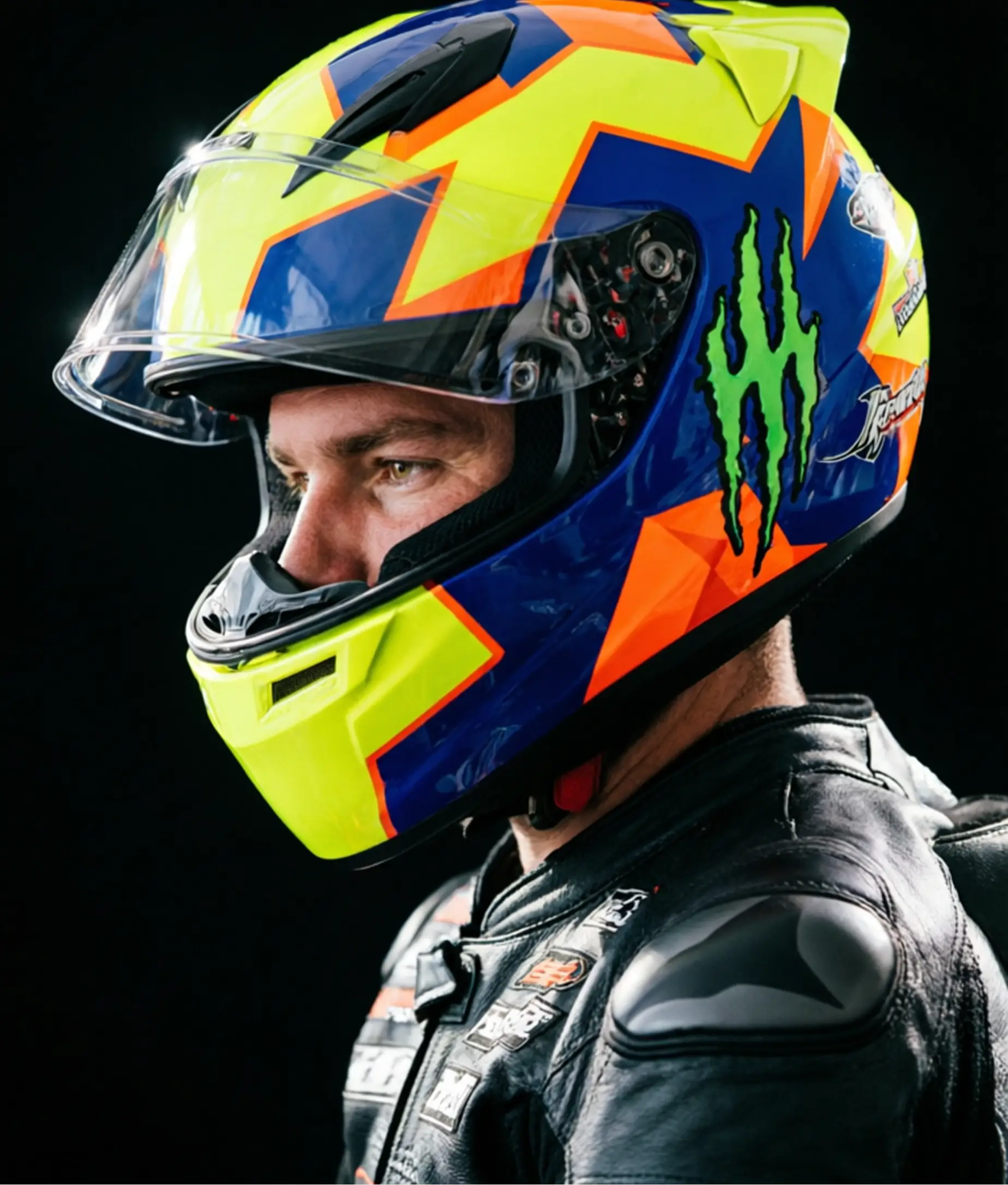 Qwen Image 2 hyper realistic portrait of racer wearing colorful motorsport helmet and leather suit
